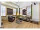 Living area with tall ceilings, wood floors, unique artwork, and ample natural light at 692 Kirkwood Se Ave # A, Atlanta, GA 30316
