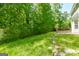 The backyard includes a grass lawn, some woods, and a wooden deck at 420 Callaway Pt, Mcdonough, GA 30252