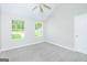 Bright bedroom with carpet flooring, neutral walls, and natural light at 420 Callaway Pt, Mcdonough, GA 30252