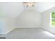 Cozy bedroom with carpet flooring, neutral walls, ceiling fan, and natural light at 420 Callaway Pt, Mcdonough, GA 30252