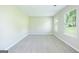 Bright bedroom with neutral walls, plush carpeting, and plenty of natural light from the double windows at 420 Callaway Pt, Mcdonough, GA 30252
