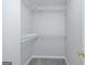 Walk-in closet features carpet flooring and adjustable storage racks at 420 Callaway Pt, Mcdonough, GA 30252