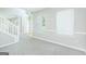 Spacious living room with neutral carpet, abundant natural light, and fresh, painted walls at 420 Callaway Pt, Mcdonough, GA 30252