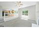 Cozy living space open to the kitchen with neutral walls and carpet, and lots of natural light at 420 Callaway Pt, Mcdonough, GA 30252