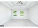 Bright main bedroom features plush carpet flooring, neutral walls, and natural light at 420 Callaway Pt, Mcdonough, GA 30252