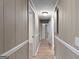 Hallway with wood-look flooring, paneled walls, and recessed lighting at 107 Club Dr, Locust Grove, GA 30248