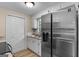 Modern kitchen with stainless steel appliances, granite countertops, and ample cabinet space at 107 Club Dr, Locust Grove, GA 30248