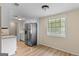 Bright kitchen with stainless steel refrigerator, modern countertops, and wood-look flooring at 107 Club Dr, Locust Grove, GA 30248