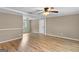 Spacious living room featuring wood-look floors and ample natural light at 107 Club Dr, Locust Grove, GA 30248