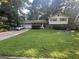 Charming two-story home with a well-manicured lawn and mature trees at 2663 Shiloh Hills Ct, Snellville, GA 30039