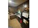 Cozy kitchen with dark cabinetry and ample counter space at 2663 Shiloh Hills Ct, Snellville, GA 30039