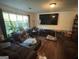 Spacious living room with a large window and hardwood floors at 2663 Shiloh Hills Ct, Snellville, GA 30039