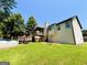 The house has an above-ground pool, a deck, covered porch, and a spacious green lawn at 5445 Maltdie, Sugar Hill, GA 30518