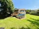 Home's backyard features a deck, covered porch, spacious yard and above-ground pool at 5445 Maltdie, Sugar Hill, GA 30518
