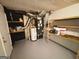 Basement utility area with water heater and painted concrete floor at 5445 Maltdie, Sugar Hill, GA 30518