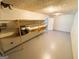 Unfinished basement area with shelving and painted concrete floor at 5445 Maltdie, Sugar Hill, GA 30518