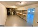 Unfinished basement area with painted concrete floor and storage at 5445 Maltdie, Sugar Hill, GA 30518