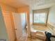 Bathroom featuring a soaking tub and decorative tile surround at 5445 Maltdie, Sugar Hill, GA 30518