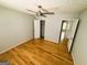 Bedroom featuring a ceiling fan, hardwood floors, and closet at 5445 Maltdie, Sugar Hill, GA 30518