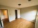 This is a bedroom with wood-look flooring and a closet with white doors at 5445 Maltdie, Sugar Hill, GA 30518