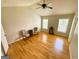 Bright bedroom with vaulted ceiling, hardwood floors, and a ceiling fan at 5445 Maltdie, Sugar Hill, GA 30518