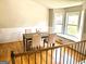 Bright dining room features hardwood floors, neutral walls, and natural light from the window seat at 5445 Maltdie, Sugar Hill, GA 30518