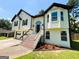 Charming two-story home featuring a welcoming entrance, attached garage, and well-manicured lawn at 5445 Maltdie, Sugar Hill, GA 30518
