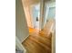 Hallway featuring hardwood floors and access to the bedroom at 5445 Maltdie, Sugar Hill, GA 30518