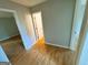 Hallway with laminate wood flooring connects different rooms in the home at 5445 Maltdie, Sugar Hill, GA 30518