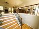 View of the stairs to the living and dining area featuring hardwood floors at 5445 Maltdie, Sugar Hill, GA 30518