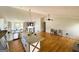 Inviting kitchen boasts granite counters, stainless appliances, hardwood floors, and an island with seating at 5445 Maltdie, Sugar Hill, GA 30518