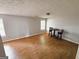 Spacious living room with wood-look flooring and natural light at 5445 Maltdie, Sugar Hill, GA 30518