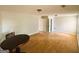 Large living room with wood-look flooring and overhead lighting at 5445 Maltdie, Sugar Hill, GA 30518