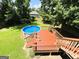 Aerial shot of the deck and above-ground pool with an attached deck at 5445 Maltdie, Sugar Hill, GA 30518