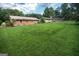Generous backyard with lush lawn and a brick home, ideal for outdoor activities at 6233 Castlewood Dr, Morrow, GA 30260