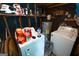 Functional laundry room with washer, dryer, water heater, and ample storage space at 6233 Castlewood Dr, Morrow, GA 30260