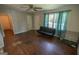Inviting living room featuring hardwood floors, a ceiling fan, and plenty of natural light at 6233 Castlewood Dr, Morrow, GA 30260