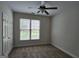 Bedroom with carpet, overhead fan and a window providing natural light and views at 7235 Thoreau Cir, Atlanta, GA 30349
