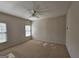 Bright bedroom featuring neutral walls, carpeted floors, and ample natural light from the large windows at 7235 Thoreau Cir, Atlanta, GA 30349