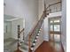 Inviting foyer with hardwood floors, staircase, and decorative trim, creating a grand entrance to the home at 7235 Thoreau Cir, Atlanta, GA 30349