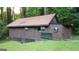 Exterior shot of an outbuilding that features an interesting retro design at 4567 Town Crier Sw Rd, Lilburn, GA 30047