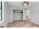 This bedroom includes closet space and hardwood-style flooring at 147 Pine St, Covington, GA 30014