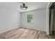 Bedroom with fan light and a view from the window at 147 Pine St, Covington, GA 30014
