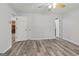 Spacious bedroom with ceiling fan has access to several rooms at 147 Pine St, Covington, GA 30014