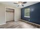 This bedroom includes closet space and hardwood-style flooring at 147 Pine St, Covington, GA 30014