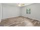 Spacious bedroom features a ceiling fan and a window overlooking a lush green view at 147 Pine St, Covington, GA 30014