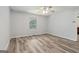 Bright bedroom features a ceiling fan and a window with green outdoor views at 147 Pine St, Covington, GA 30014