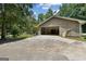 Spacious detached garage featuring an open bay and a concrete driveway at 147 Pine St, Covington, GA 30014