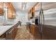 Well-equipped kitchen featuring stainless steel appliances and a tile floor at 147 Pine St, Covington, GA 30014