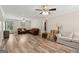 Spacious living room with hardwood floors and two seating areas for entertaining guests at 147 Pine St, Covington, GA 30014